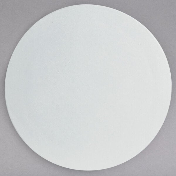 A white G.E.T. Enterprises Bugambilia medium round disc with a smooth surface.