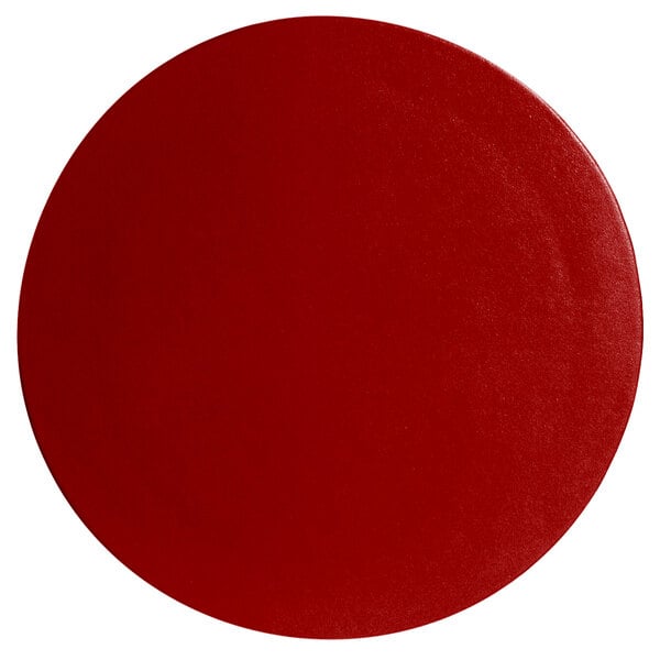 A fire red round disc with a textured finish.