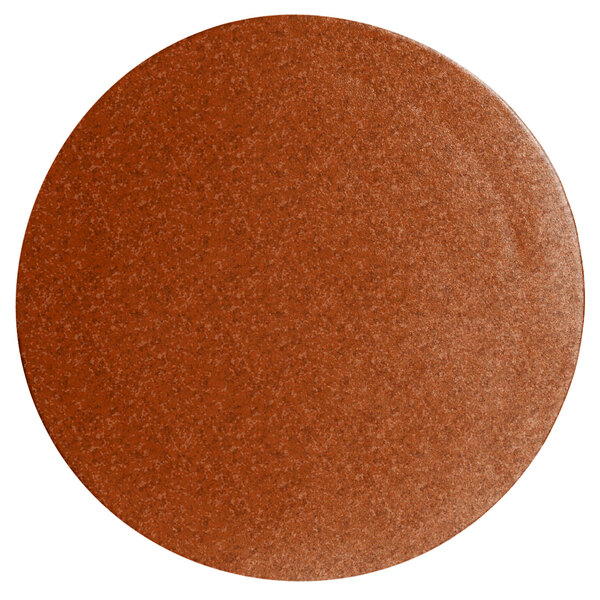 A brown round disc with a textured finish.