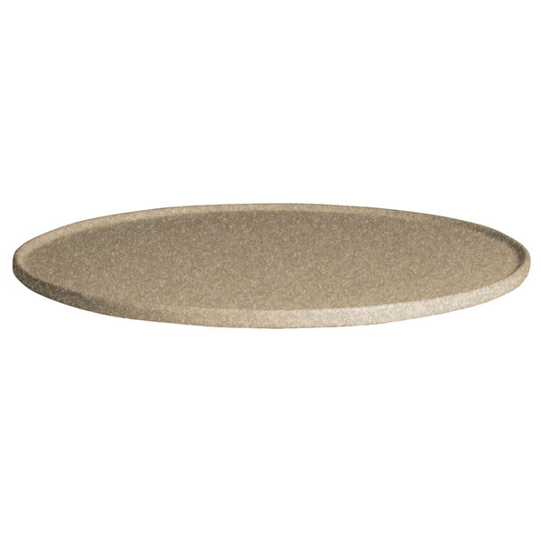 A G.E.T. Enterprises round sand granite disc with rim on a table with salad.