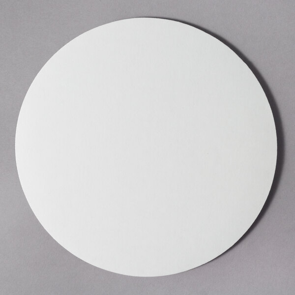 An 8" white corrugated cake circle.