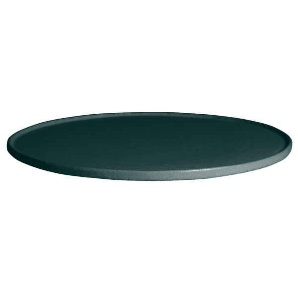 A forest green G.E.T. Enterprises Bugambilia deep round disc with a rim on a round black surface.