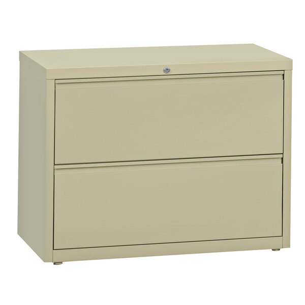 A putty Hirsh Industries two-drawer lateral file cabinet.