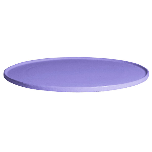 A lavender G.E.T. Enterprises Bugambilia resin-coated aluminum disc with rim on a table.
