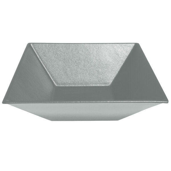 A silver triangular steel bowl with a MOD finish.