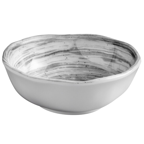 A white bowl with black speckled stripes.