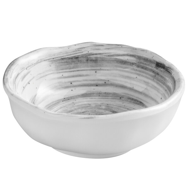 A white bowl with black swirls on the inside.
