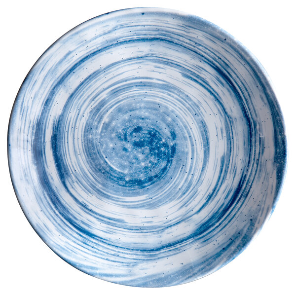 A white melamine plate with blue swirls on it.