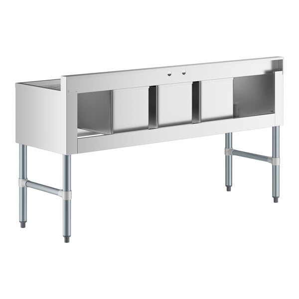 A stainless steel three-bowl sink with two side drainboards and four sturdy legs.