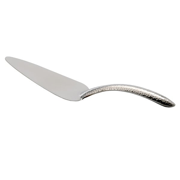 A silver cake server with a curved handle.