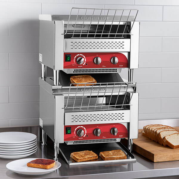 An Avantco commercial toaster with a tray of toast in it.