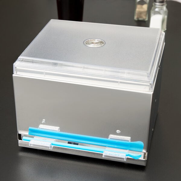 A stainless steel box with blue handles holding blue straws.