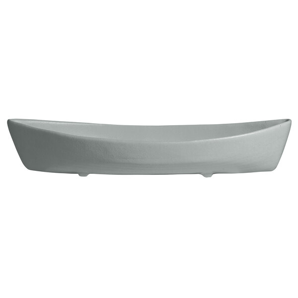 A white boat-shaped platter with a textured edge.
