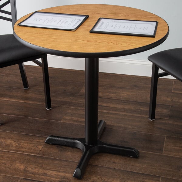 A Lancaster Table & Seating table with menus on it.