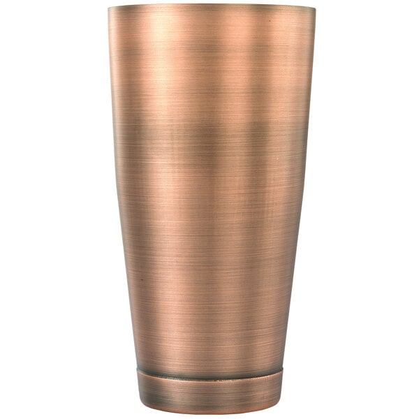 An antique copper-plated cocktail shaker tin.