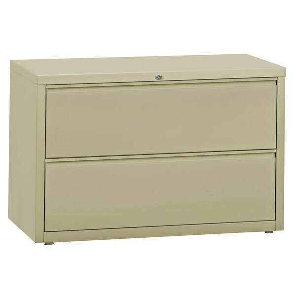 A putty Hirsh Industries two-drawer lateral filing cabinet.