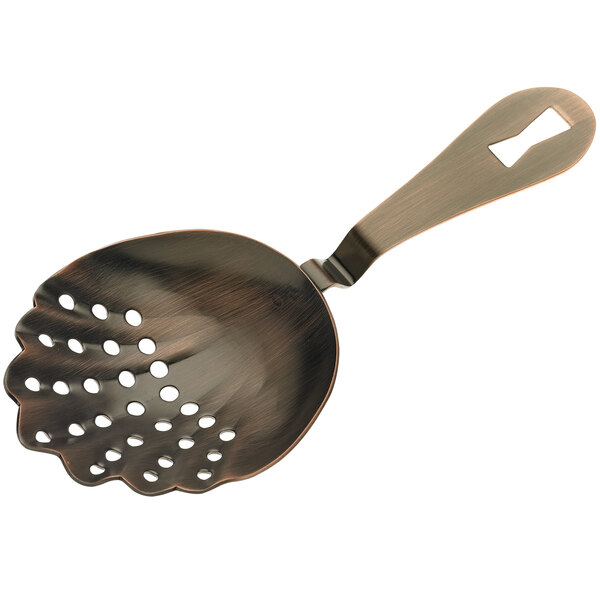 An antique copper Barfly scalloped strainer with holes in the spoon.