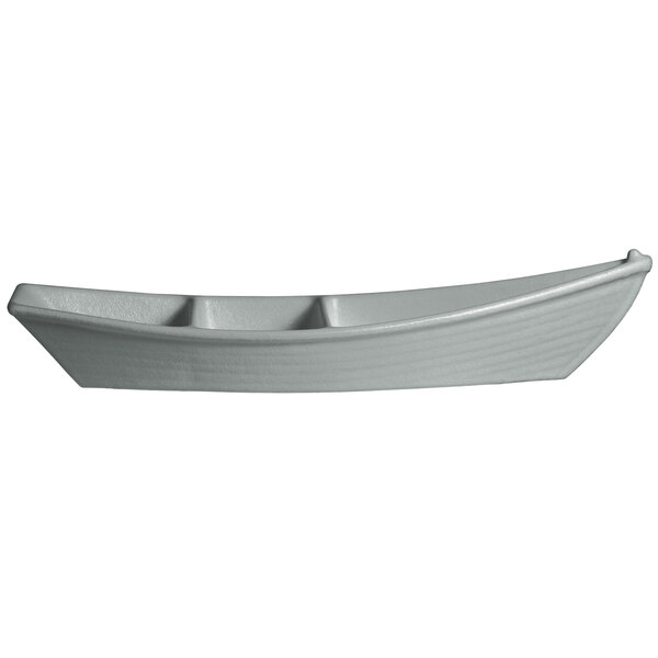 A white G.E.T. Enterprises steel boat with dividers.