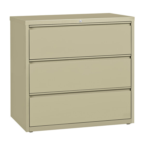 A Hirsh Industries putty three-drawer lateral file cabinet.