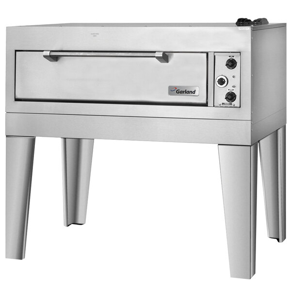 A stainless steel Garland double deck pizza oven on legs.