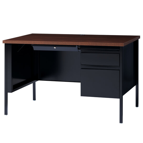 A black desk with a wooden drawer and pedestal.