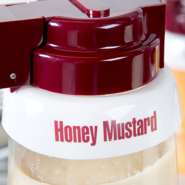 A Tablecraft white plastic lid with maroon lettering for honey mustard.