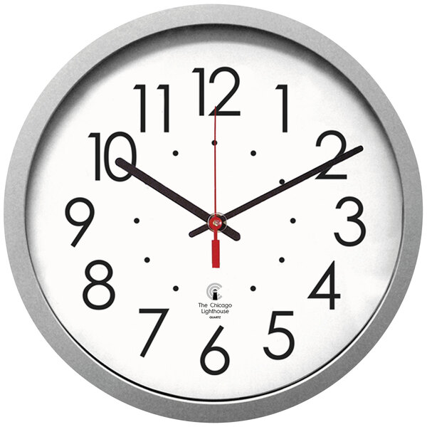 A white clock with black numbers and a flat silver rim.