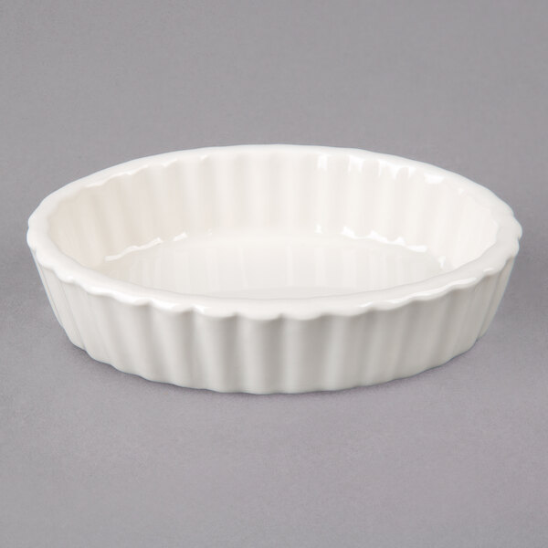 Tuxton BEK0306 3 oz. Eggshell Oval Fluted China Souffle / Creme Brulee