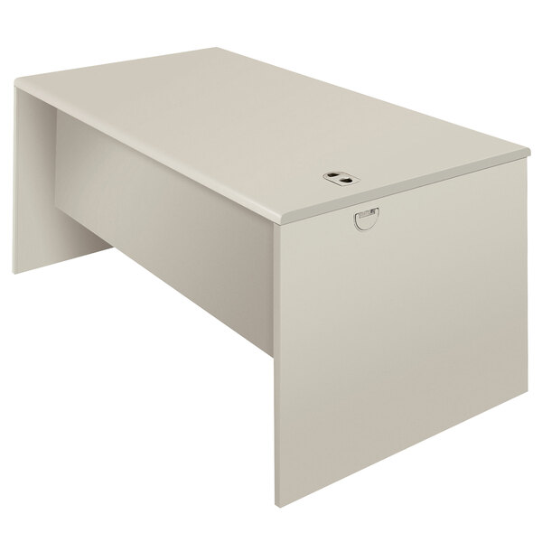 A silver mesh and light gray laminate HON desk shell on a white background.