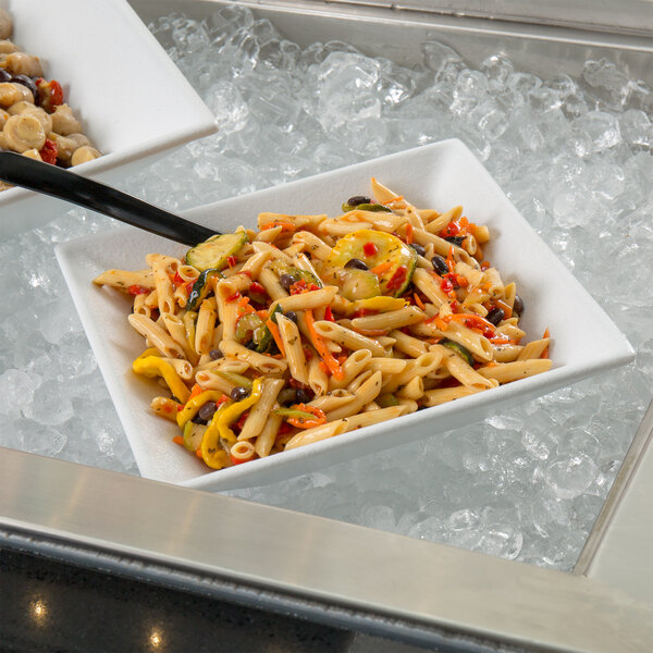 A G.E.T. Enterprises white resin-coated aluminum deep square bowl of pasta with vegetables and a spoon.