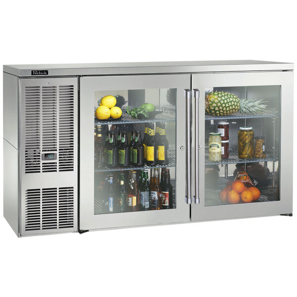 A Perlick stainless steel back bar refrigerator with glass doors and glass shelves filled with drinks and fruits.