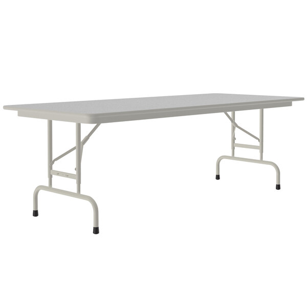 A white rectangular table with a gray granite top and gray metal legs.