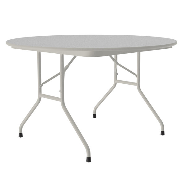 A white folding table with gray legs.