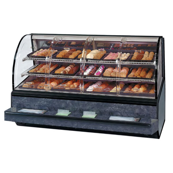 A Federal Industries Series '90 curved dry self-service bakery case on a bakery counter with various types of pastries.