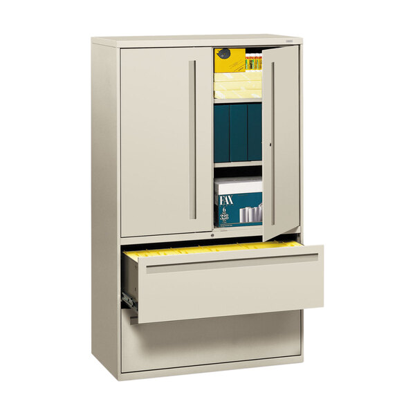 A light gray HON file cabinet with two lateral filing drawers.