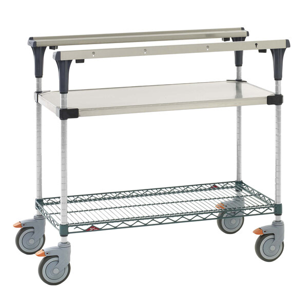 A Metro stainless steel cart with shelves and wheels.
