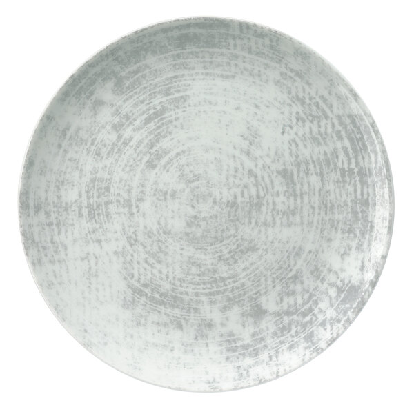 A white porcelain coupe plate with a circular grey pattern.