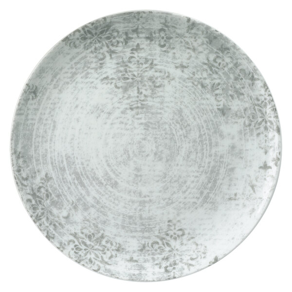 A Schonwald round porcelain coupe plate with a grey design on it.