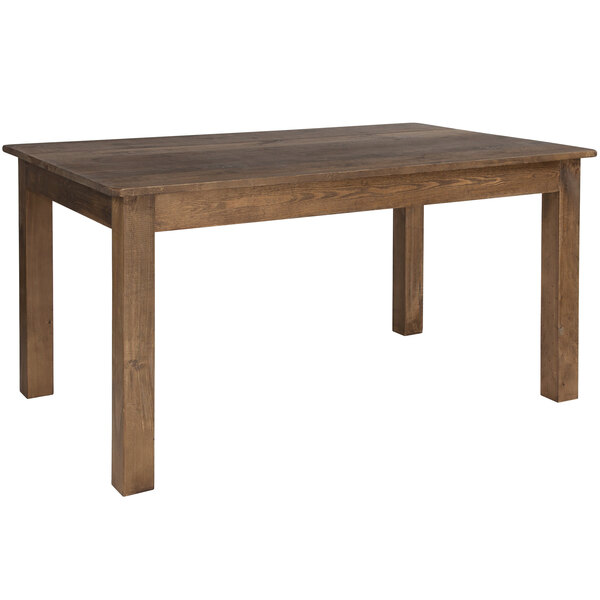 A Flash Furniture Hercules 38" x 60" Antique Rustic Solid Pine Farm Table with dark brown legs.