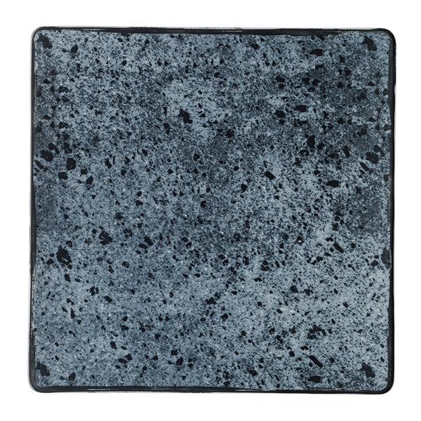 A Schonwald Shabby Chic square porcelain plate with a white background and black and grey stone speckles.