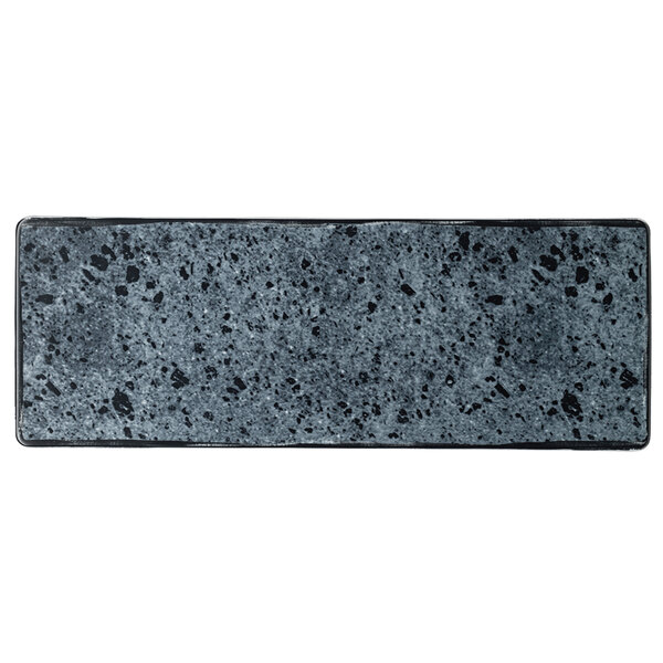 A rectangular stone platter with a grey speckled surface.