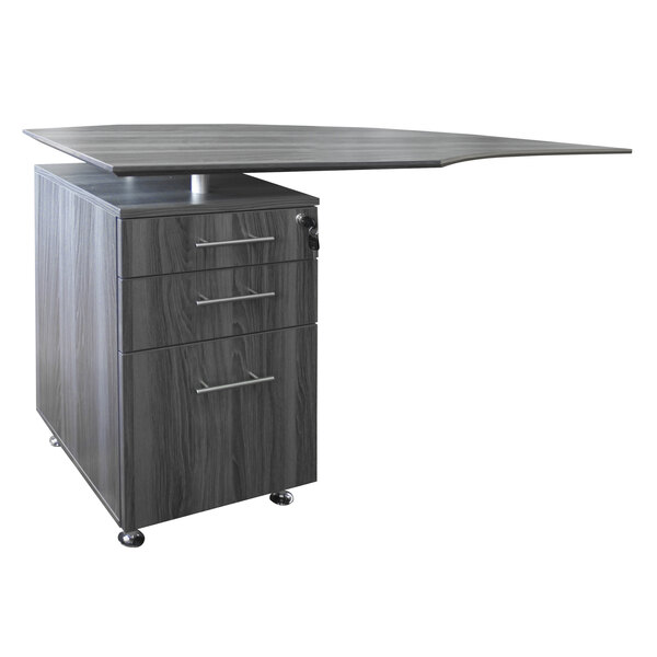 A grey Safco Medina pedestal file cabinet on a desk with a table top.