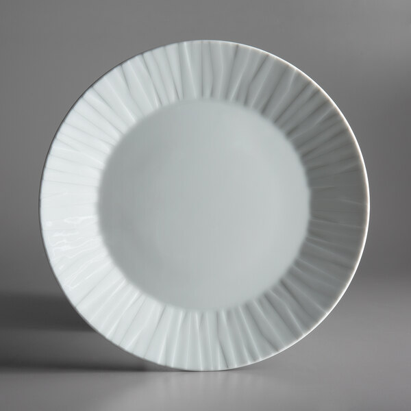 A Schonwald white porcelain plate with a wavy edge.
