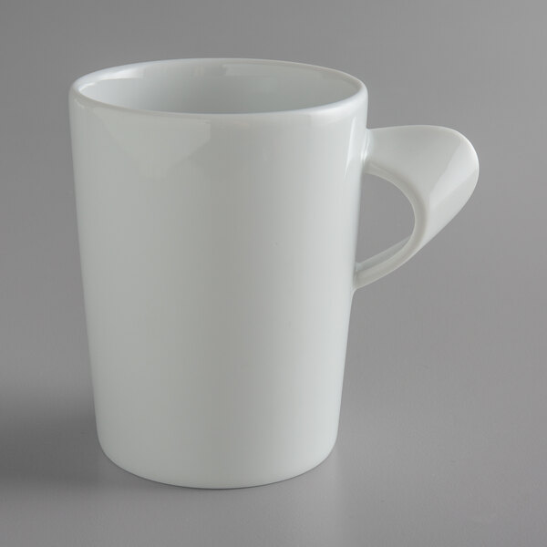 A white Schonwald tall cup with a handle.