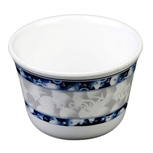 A white melamine tea cup with a blue dragon design on the inside.