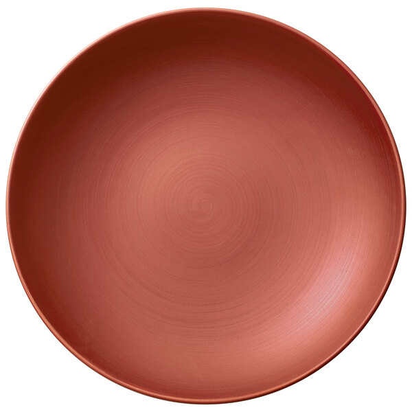 A close-up of a Villeroy & Boch Copper Glow deep bowl with a spiral pattern on a white background.