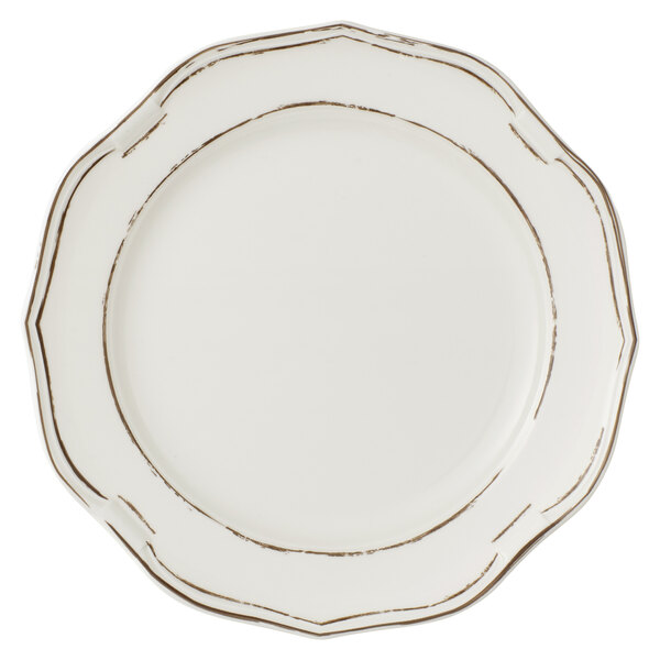 A white Villeroy & Boch porcelain coupe plate with a brown rim.