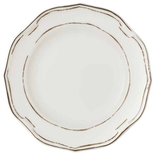 A white Villeroy & Boch porcelain coupe plate with gold trim.
