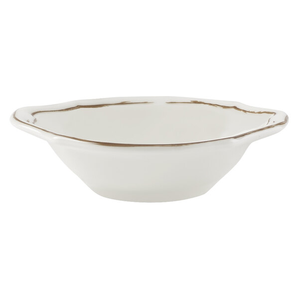 A Villeroy & Boch white porcelain bowl with gold trim.