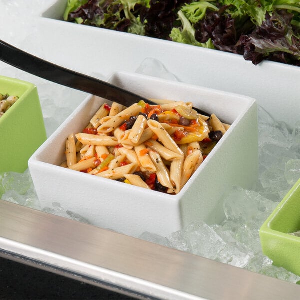 A G.E.T. Enterprises Bugambilia white square dressing insert on a table in a salad bar filled with pasta, vegetables, and a fork.